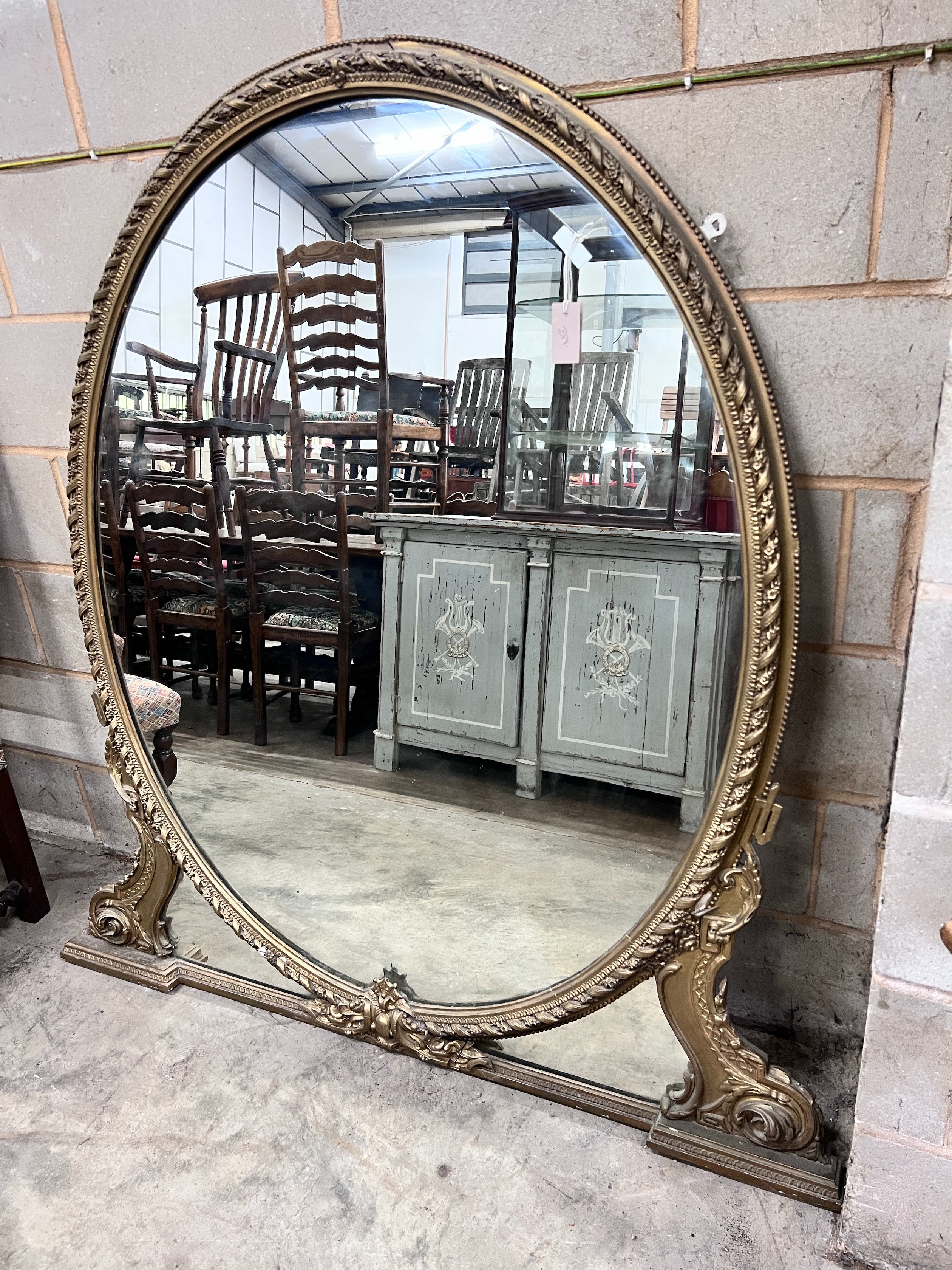 A late Victorian gilt gesso overmantel mirror, width 144cm, height 150cm *Please note the sale commences at 9am.